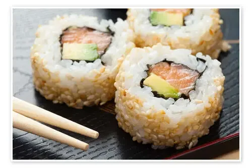 Sushi on wooden plate with chopsticks Editors Choice
